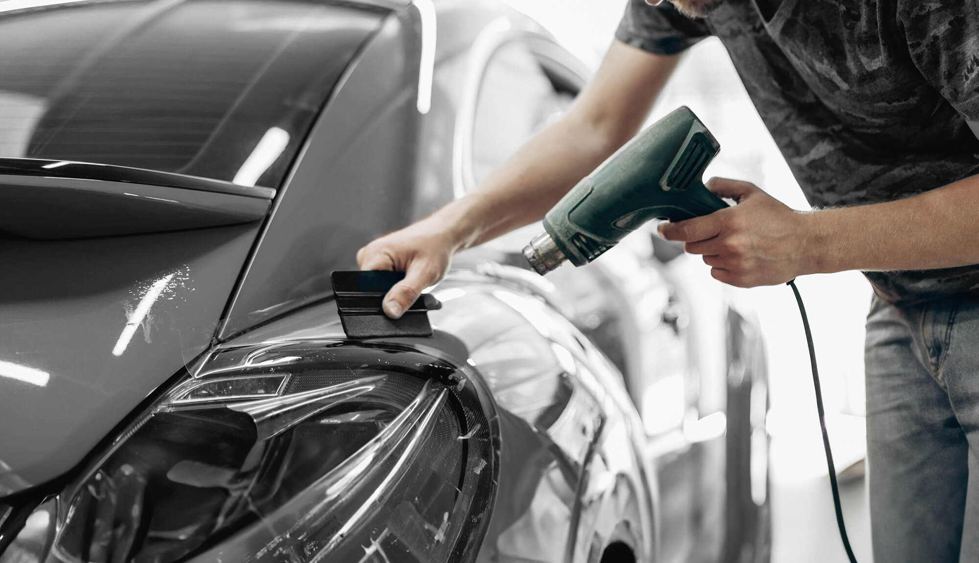 An image of a detailer applying a CYD Film film